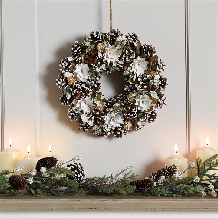 Snow-covered Pinecone and White Floral Wreath