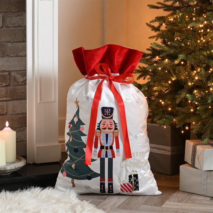 White and Red Nutcracker with Tree Present Sack
