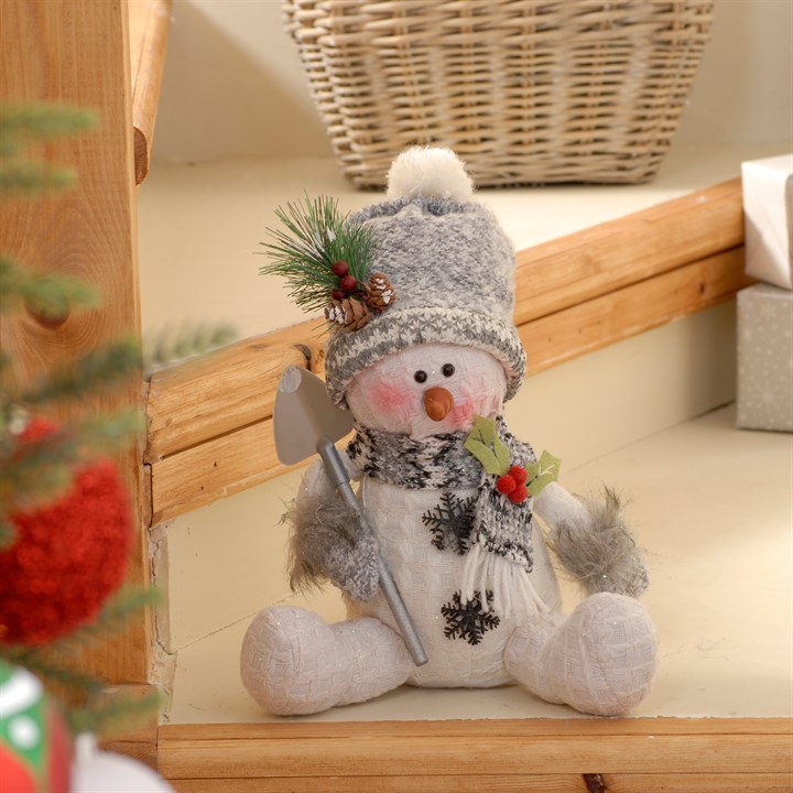 Grey Sitting Snowman with Snow Spade